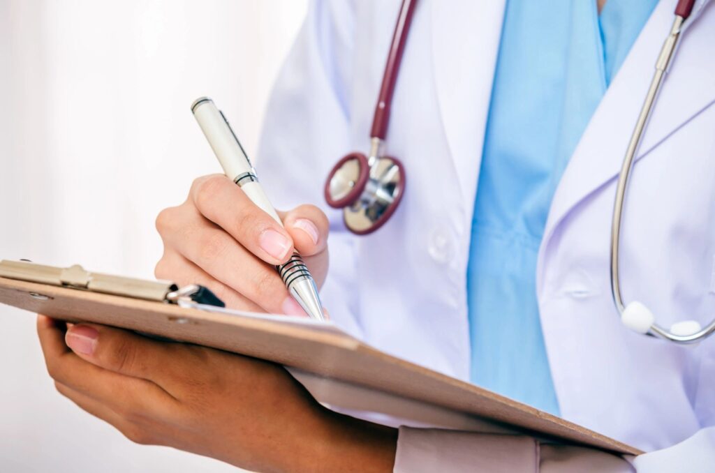 doctor reading hippa guidelines